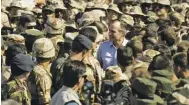  ??  ?? President George H.W. Bush visiting American troops in Saudi Arabia before the 1991 Gulf War.