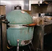  ?? MIA YAKEL ?? The well-used XL Big Green Egg in the kitchen at Muss &amp; Turner’s.
