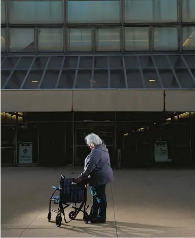  ?? ?? At top: “Susan” stands with her late mother’s wheelchair on Feb. 5 at the Skokie Courthouse, where her mother testified about being sexually assaulted by a nurse at Glenbrook Hospital.