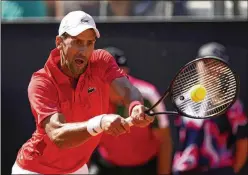  ?? ALESSANDRA TARANTINO/ASSOCIATED PRESS ?? Novak Djokovic had a bad day Sunday at the Italian Open, falling in straight sets to Alejandro Tabilo in a third-round match that lasted just 68 minutes. Djokovic called his performanc­e “a bit concerning.”