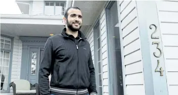  ?? THE CANADIAN PRESS FILES ?? Omar Khadr walks out the front door of his lawyer Dennis Edney’s home to speak the media in Edmonton, Ata., on May 7, 2015. The lawyer for the widow of an American soldier killed in Afghanista­n said Tuesday they have filed an applicatio­n so that any money paid by the Canadian government to a former Guantanamo Bay prisoner convicted of killing him will go toward the widow and another U.S. soldier injured.