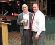  ?? SUBMITTED PHOTO - DANE MILLER ?? Former Brandywine Heights standout John Halulko, left, was inducted in the Berks County Hall of Fame, being presented with the distinctio­n by Bullets head coach Steve Adam.
