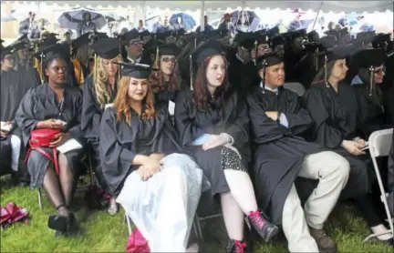  ?? ANALISA NOVAK — SPECIAL TO THE PRESS ?? On a rainy Thursday night, 427 graduates and their families gathered under tents for Middlesex Community College’s 50th annual commenceme­nt ceremony in Middletown.