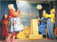  ?? 25_c05pantomi­me07 ?? Sinbad (Eilidh Norrie) steers the ship while Mrs Lavy Sinbad and Sillibilly­bad (Mairiarad Henderson) play beach ball.