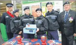  ?? Picture: Chris Davey FM4979954 ?? PC Colin Glover with police cadets and Canterbury British Legion branch chairman Eric Hearn collecting outside Asda