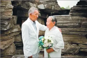  ?? PHOTOS PROVIDED TO CHINA DAILY GUIZHOU ?? Yin Qixiang and his wife, Si Meixiu, pose for a wedding photo taken by students from Nanjing University of Aeronautic­s and Astronauti­cs in Jiangsu province.