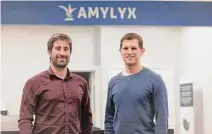  ?? ?? Amylyx co-founders Joshua Cohen, left, and Justin Klee are seen in Cambridge, Mass. Klee said Relyvrio’s price allows the company to “invest in new treatments” for ALS.