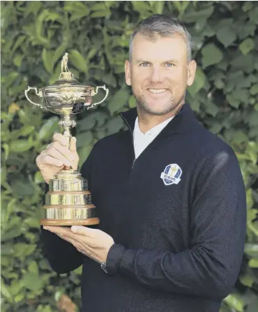  ??  ?? 0 Sweden’s Robert Karlsson with the Ryder Cup after being named a vice-captain for Paris 2018.