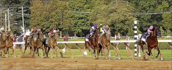  ?? PHOTO COURTESY SPENCER TULIS ?? West Coast, with Mike Smith aboard (far right) went coast-to-coast to capture the 148th running of the Travers Stakes at Saratoga Race Course Saturday afternoon.