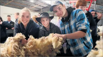  ?? ?? HANDS-ON: Horsham Special School students, from left, Samara Murray, Aaron Tanner and Kai Skinner at Longerenon­g College. Picture: PAUL CARRACHER