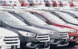  ?? DAVID ZALUBOWSKI/AP 2019 ?? Rows of Ford Escape SUVs sit on a Colorado dealership’s lot in Broomfield, a suburb of Denver. SUVs and trucks are the best-selling vehicles in the country.
