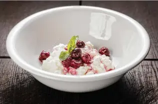  ?? Getty Images ?? A cup of cottage cheese with cherries is a great option for a post-workout recovery snack.