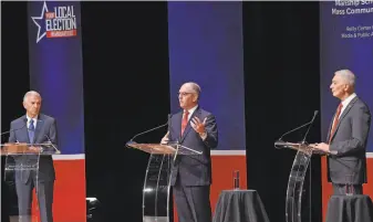  ?? Bill Feig / Associated Press ?? Eddie Rispone (left) and Gov. John Bel Edwards and Republican Rep. Ralph Abraham debate in Baton Rouge, La., in September. Rispone and Edwards now face a runoff election for governor.