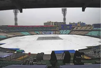  ?? AFP ?? The Eden Gardens is covered ahead of the first Test. The forecast is not good for today and tomorrow and the weather is only expected to clear up from Saturday onwards.