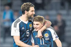  ??  ?? FRIENDS REUNITED: Mulgrew and James Forrest impressed for Scotland