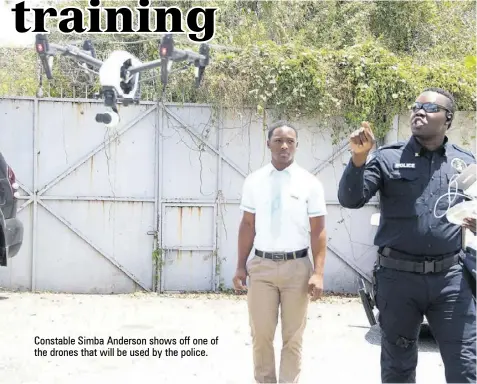  ?? ?? Constable Simba Anderson shows off one of the drones that will be used by the police.