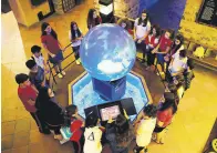  ??  ?? Children will learn details about our universe with a magic sphere at the Astronomy Workshop.