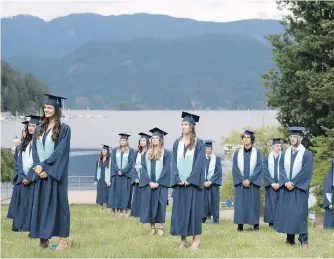  ??  ?? Graduating students from Seycove Secondary in North Vancouver stand physically distanced for their graduation photo. The coronaviru­s pandemic is forcing all education leaders back to the drawing board to rewrite the next phase of their institutio­nal existence, Geoff Johnson writes.