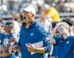  ?? STAFF PHOTO BY DOUG STRICKLAND ?? UTC football coach Tom Arth shouts from the sideline during Saturday’s game against The Citadel at Finley Stadium.