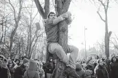  ?? Vadim Ghirda / Associated Press ?? Thousands turned out to Bucharest, Romania, to watch a military parade celebratin­g 100 years since the country became a modern-day state.