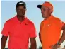  ?? — AFP ?? Tiger Woods with Rickie Fowler.