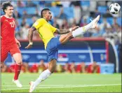  ??  ?? Brazil's Paulinho controls the ball during their match against Serbia.