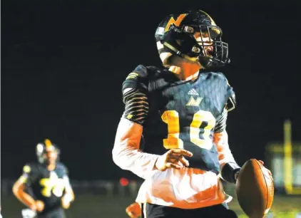  ?? STAFF PHOTOS BY TROY STOLT ?? North Murray quarterbac­k Seth Griffin celebrates after scoring a touchdown against Lafayette on Friday in Chatsworth, Ga.