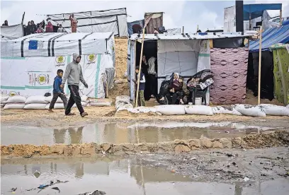  ?? FATIMA SHBAIR/ASSOCIATED PRESS ?? Access to toilets is a major concern at a sprawling encampment for displaced Palestinia­ns in Rafah, in southern Gaza.