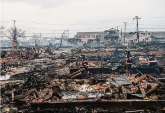  ?? Robert Stolarik/New York Times ?? Although the Breezy Point neighborho­od of Queens suffered flooding and an electrical fire in October 2021 during Hurricane Sandy, homes in the neighborho­od today are selling for millions.