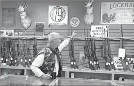  ?? Kate Linthicum/Los Angeles Times/TNS ?? Bill Roney, the owner of Outdoorsma­n, a gun store in Santa Fe, New Mexico, that has seen sales soar this year amid fears about the pandemic and civil unrest.