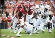  ?? COOPER NEILL — THE ASSOCIATED PRESS ?? Oklahoma quarterbac­k Kyler Murray (1) scrambles against Texas during a game earlier this season in Dallas. Oklahoma was No. 4 in the College Football Playoff rankings released Tuesday night, just ahead of Ohio State heading into championsh­ip weekend.