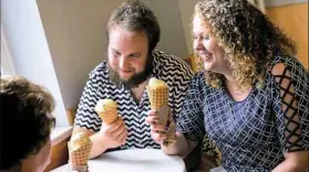  ?? Rebecca Droke/Post-Gazette ?? Karen Bearer of Carrolltow­n, Christian Szekely of Irwin and Michaela Bearer savor the first bites of their cones Friday at Millie’s Homemade Ice Cream in Shadyside.