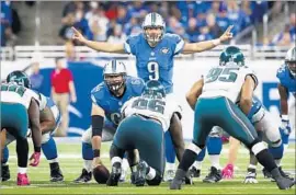  ?? Rick Osentoski Associated Press ?? DETROIT LIONS quarterbac­k Matthew Stafford gets set to run a play against the Philadelph­ia Eagles last Sunday. The Lions handed the Eagles their first loss.