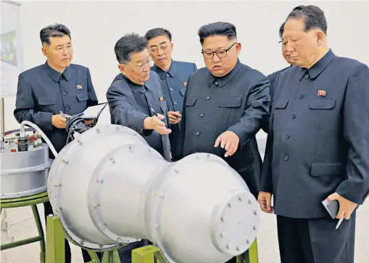  ??  ?? Kim Jong-un inspects what state media says is a hydrogen bomb