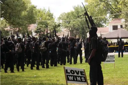  ?? Photograph: Leslie Spurlock/ZUMA Wire/REX/Shuttersto­ck ?? Black Lives Matter protesters gather in a park in Louisville, Kentucky, where they were demonstrat­ing over the death of Breonna Taylor.