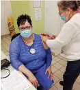  ??  ?? SOCIAL Developmen­t MEC Sharna Fernandez getting her Covid-19 jab.