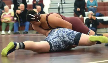  ?? AUSTIN HERTZOG - DIGITAL FIRST MEDIA ?? Pottsgrove’s Manny Allen, top, works to turn Upper Perkiomen’s Nick Petilico for a pin at 285 pounds Wednesday.