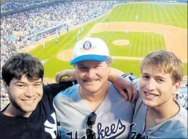  ?? Rosenberg family ?? DON ROSENBERG, center, with sons Drew, left, and Evan at a game. Drew was killed in an accident involving a man in the U.S. on temporary protected status.