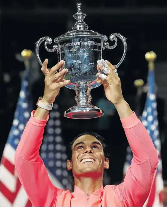  ?? / REUTERS / MIKE SEGAR ?? Rafael Nadal of Spain holds aloft the US Open trophy after defeating Kevin Anderson in Sunday’s final.