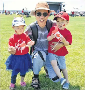  ?? DESIREE ANSTEY/ JOURNAL PIONEER ?? Mae, from left, Eason and Zheng Fan had plenty to celebrate on July 1 as the family immigrated from China to P.E.I. six years ago on Canada Day.