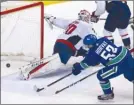  ?? The Canadian Press ?? Canucks forward Bo Horvat scores on Washington Capitals goalie Braden Holtby during first-period NHL action in Vancouver onThursday.TheCanucks­won6-2.