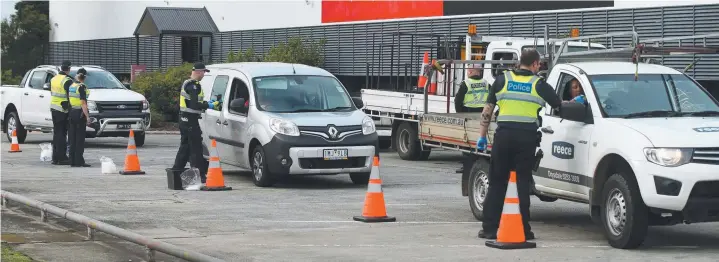  ?? Pictures: ALISON WYND ?? BUSY DAY: Yesterday’s multi-agency operation on Fellmonger­s Rd, Breakwater, involves breath-tests, drug tests and vehicle searches using sniffer dog Floyd (below).