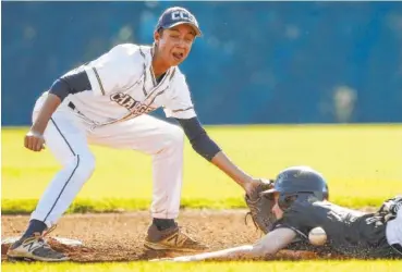 ?? STAFF PHOTO BY DOUG STRICKLAND ?? Signal Mountain runner Drew Lowry is safe at second base as he is hit by the throw to Chattanoog­a Christian second baseman Taylor Anard during their baseball game Tuesday at CCS. The host Chargers won 5-3.