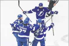  ?? JASON FRANSON — THE ASSOCIATED PRESS ?? Tampa
Bay’s Kevin Shattenkir­k (22) celebrates his goal with teammates during the first period of Monday night’s Stanley Cup Final Game 2 against Dallas in Edmonton, Alberta.