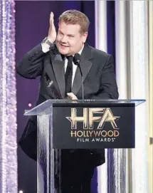  ?? Alberto E. Rodriguez Getty Images ?? HOLLYWOOD FILM AWARDS: Host James Corden pokes fun at the event’s insignific­ance at the ceremony in early November.