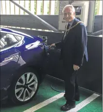  ??  ?? Lord Mayor Terry Westgate tries the charging point