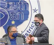  ?? Ronald Cortes/Contributo­r ?? The South San Antonio Independen­t School District board suspended Marc Puig, right, on Dec. 4.