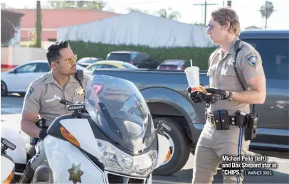  ?? | WARNER BROS. ?? Michael Peña ( left) and Dax Shepard star in “CHIPS.”