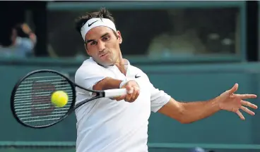  ?? /Reuters ?? Eye ball: Roger Federer is all concentrat­ion as he returns the ball during his win over Grigor Dimitrov on Monday.