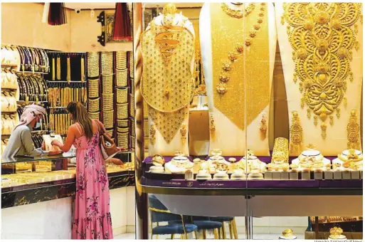  ?? Virendra Saklani/Gulf News ?? One particular location in Dubai forever linked to purchase of the yellow metal is the Gold Souq in Deira. The Gold Souq had grown to establish itself as a centre of attraction that holds several tonnes of gold at any given time and millions of carats of gemstones.